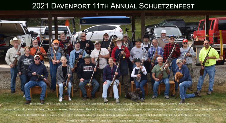 Photo of participants in the 2021 annual Schuetzenfest seated and standing holding their guns